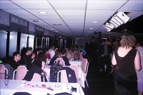 Rows of tables lined the windows on both sides of the dance floor. 