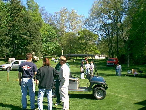 Three maintenence workers chat while the day goes on.
