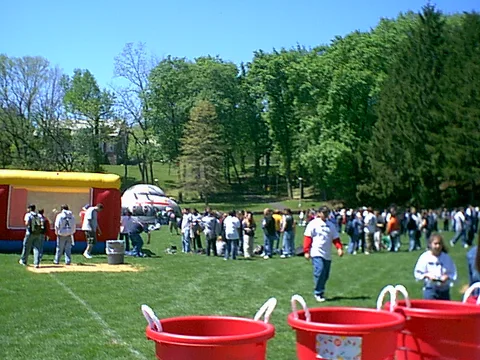 A view of the morning activities from behind the tie dye booth.