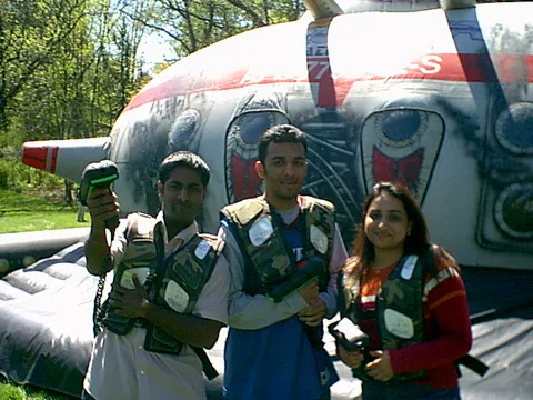 These three students pose in front of the laser tag arena after attempting to "kill" each other inside.
