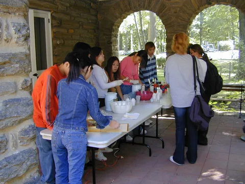 The snowcone table was set up outside the Lares building in the shade. 
