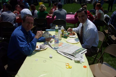 Dr. Bob and Chris Walters take a break from stuffing their food to chat.