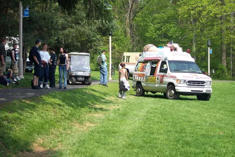 This ice cream truck was almost ready to overturn before maintenence workers safely moved it down onto the field as seen here.