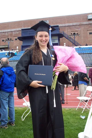 Another "nice" picture of Sarah posing with her diploma case in hand.  The diploma itself wouldn't be received until late July. 