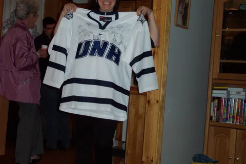 This UNH hockey jersey was presented to Sarah by Eric.  It was signed by the entire team, some of whom will most likely go pro.  She didn't take him up on his offer to return it. 