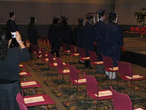 The graduates filed into the room as the band played. 