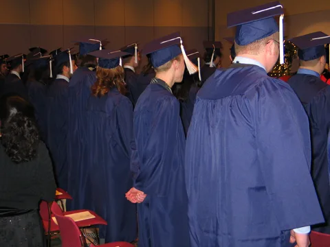 Again, Steve Sokolowski, this time second from right, awaits the beginning of the Schreyer Honors College medals ceremony. 