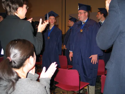 Next, it was the parents' and spouses' turn to stand and recognize the scholars' achievements. 