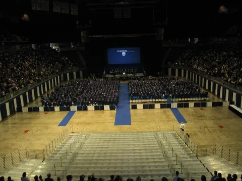 Much fanfare was made about the Penn State Alumni Association, and here a speaker inducts everyone into the Association.  Penn State has awarded over one half-million degrees. 