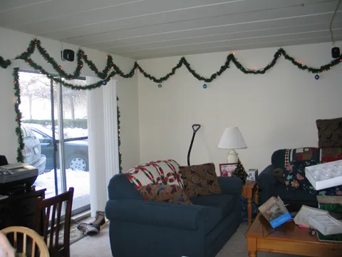 The foot of snow that covered the ground is clearly visible out the back door. 