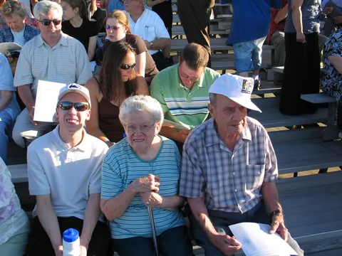 Seating was cramped in the first two rows of the bleachers. Several people told Steve to move over to the left, but he could not, because others were seated there.
