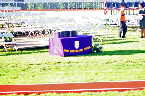 On this table would later rest the diplomas offered to the graduates.