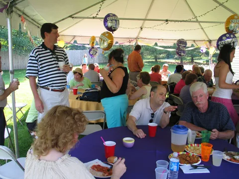 The conversation between the neighbors and the in-laws, from a different angle. Here, former neighbor Scott Curry can be seen at left as well.