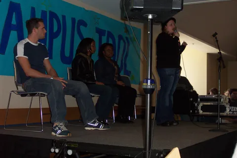 A large Campus Idol banner was hung on the wall behind the four contestants who would be representing Penn State in the finals.
