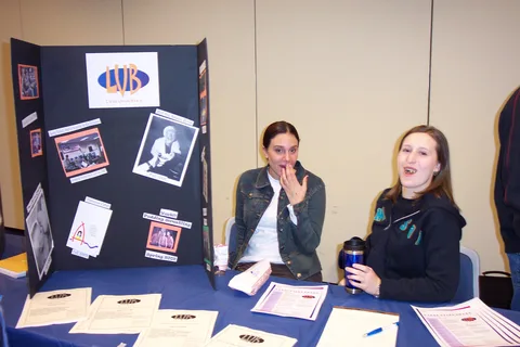Kelly Palmer and Jackie Egitto staff a table advertising the Lares Union Board's programming activities. 