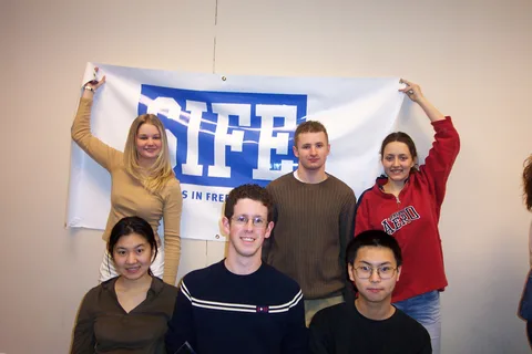 SIFE poses a group shot as well. 