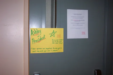 Ashley also hung signs on the doors entering into and exiting from the Lares building.