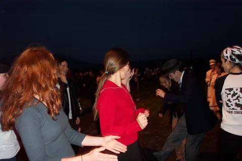 Suddenly and without warning, everyone breaks out dancing, even though the club hasn't yet reached the parade route. 