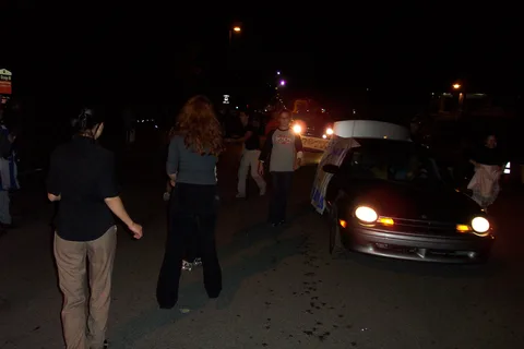 A picture taken in front of the car as it enters the parade route to adoring fans. 