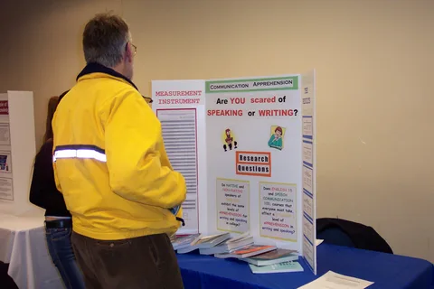 Dr. Thomas Smith, professor of English, browses through the poster fair. 