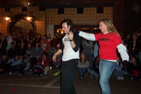 Graydon randomly pulled a "security girl" from the crowd.  While she pretended to be unwilling to dance, other (blurry) pictures show that she was smiling the whole time until the car passed out of view. 