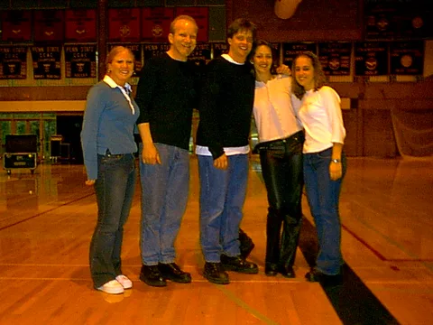 Jim poses with some other women. 