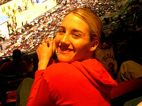Kristina Amodei turned around for a few seconds but quickly looked back at the game. 