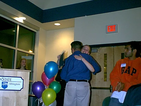 LUB President Kristina Amodei congratulates advisor Jason Bozzone, in what would prove to be his final Leadership Banquet.