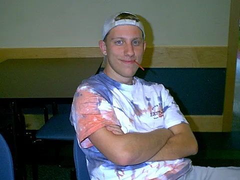 Dane's t-shirt was a sharp contrast from the suits and ties the other men attending the banquet wore.