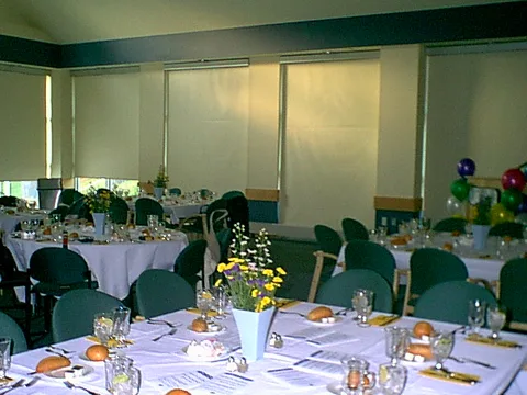 The banquet room was all set up, with sunlight streaming through the windows.