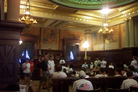 Students, wearing their "Spirit of Leadership" T-Shirts, sat on the behcnes in the Supreme Court chambers as the tour guides talked about the building's history.