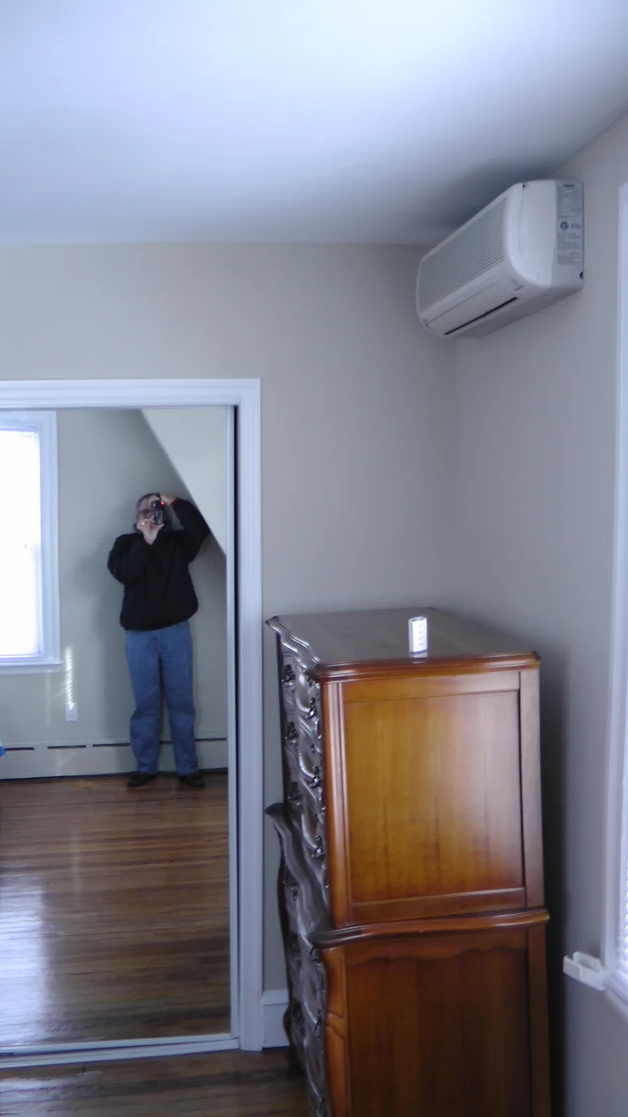 Full-length mirrors line the closet doors in the master bedroom.