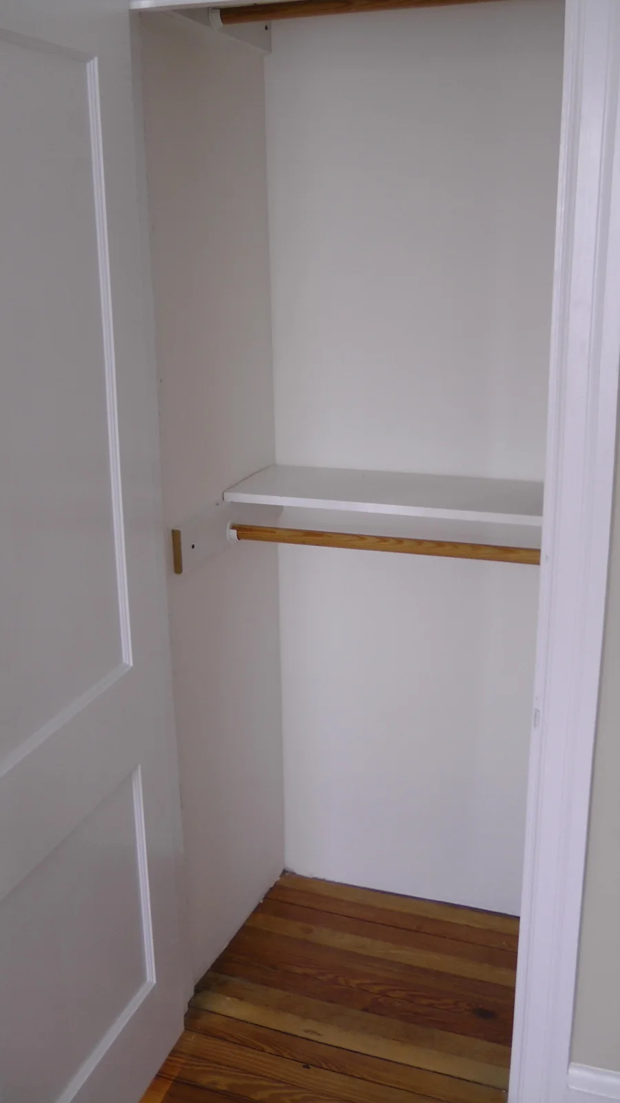 This closet may hold clothes for the occupant of the second bedroom.