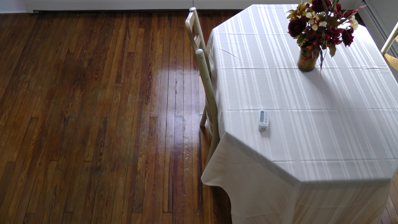 A view of the dining room, from above.  The table and chairs are not included in the price of the house.