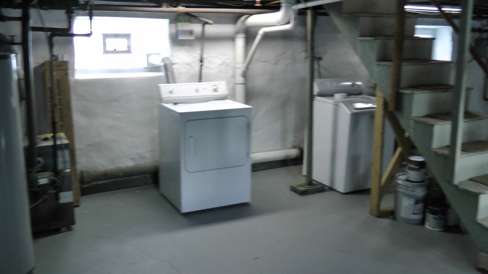 A view of the back wall of the basement. The washer and dryer in this picture are included in the price of the house.