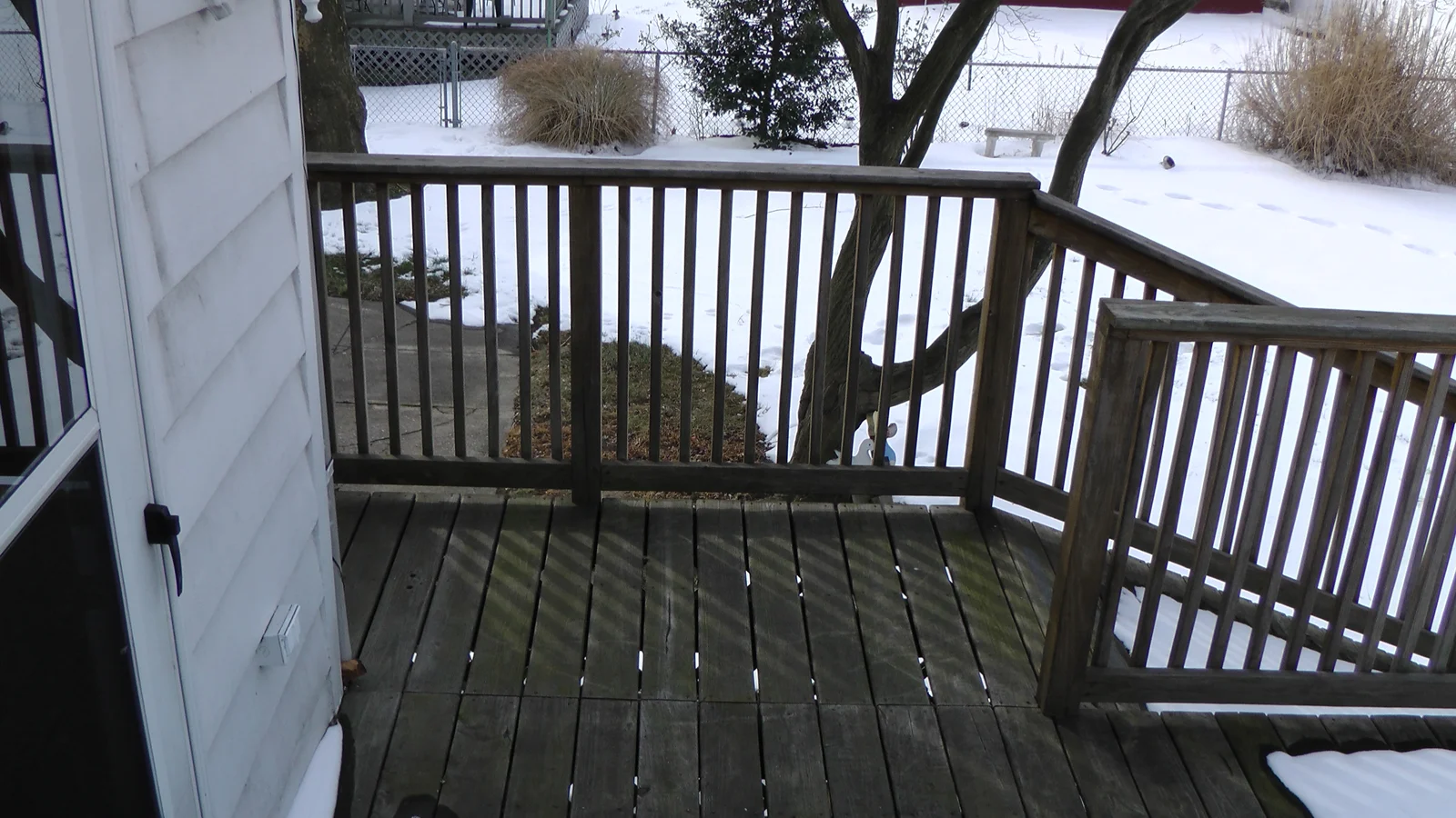 A view looking left from the door connecting the kitchen to the back deck.