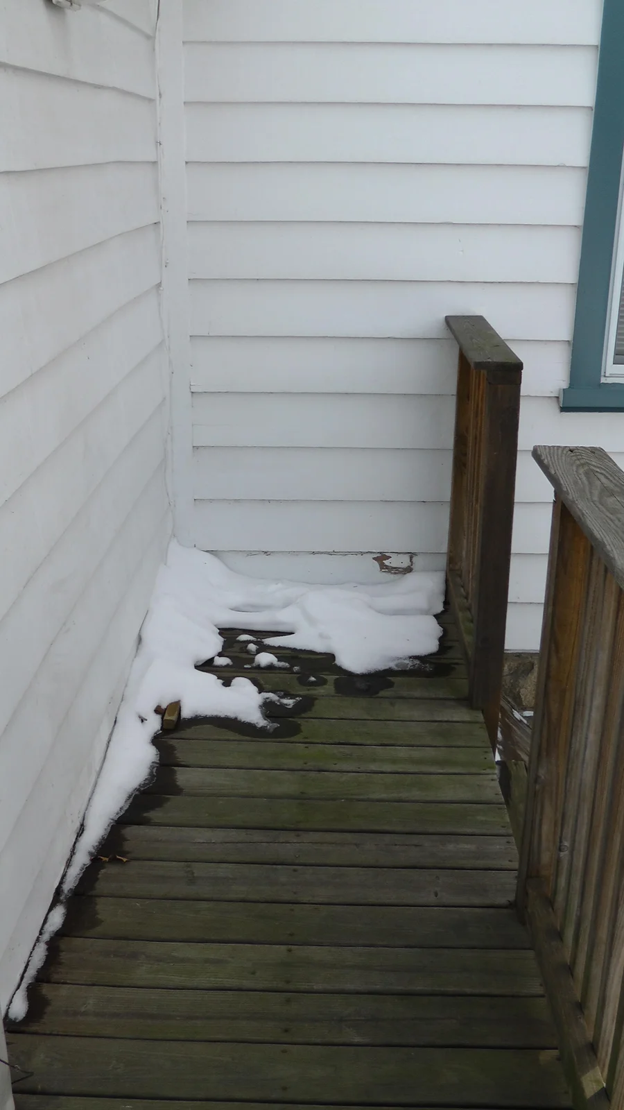 The previous occupant used this walkway, two lefts from the kitchen door, to position her working grill.