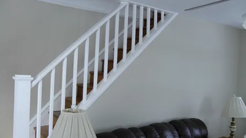 A side shot of the stairwell that connects the living area to the bedrooms.