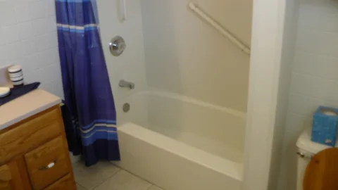 The large shower with integrated grab bar is perfect for anyone.