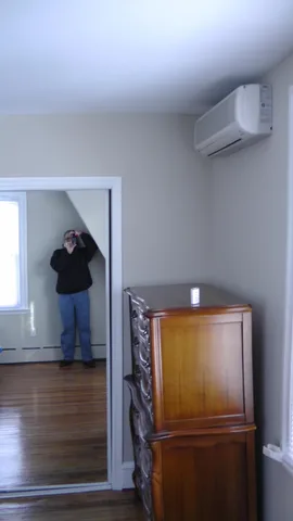 Full-length mirrors line the closet doors in the master bedroom.