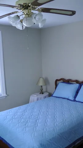 One possible placement of a bed in the master bedroom.  The bed itself is not included in the price of the property.