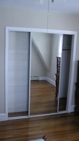 Another shot of the full-length mirrors lining the closet doors.