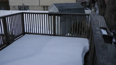 The deck is large enough to fit both a large picnic table and a barbeque grill for outdoor cooking.